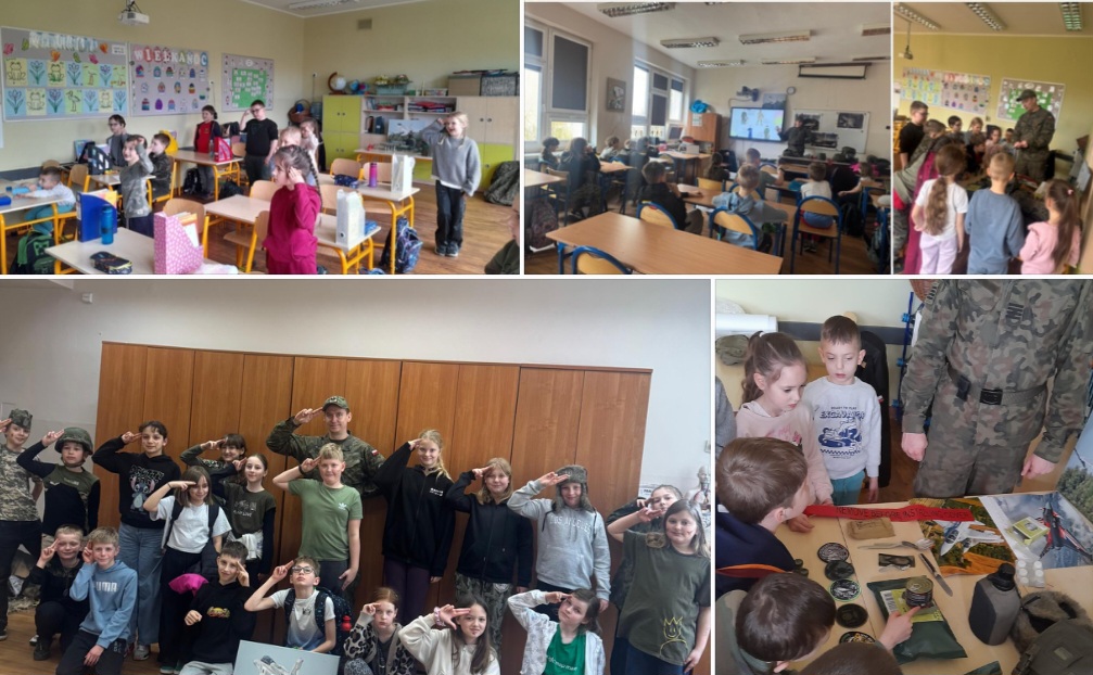 Uczniowie salutujący, uczniwoie stojący przy stole ze sprzętem wojskowym i oglądający go